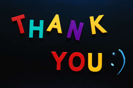Thank you made of colorful letters on a blackboardの写真素材