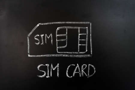 SIM card drawn in chalk on a blackboardの写真素材