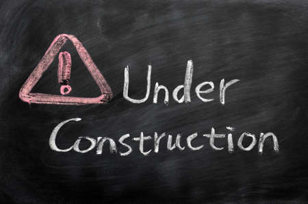 Page under construction concept drawn in chalk on a blackboard