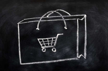 Shopping bag concept drawn in chalk on a blackboardの写真素材