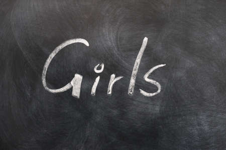 Girls - word written in white chalk on a blackboardの写真素材