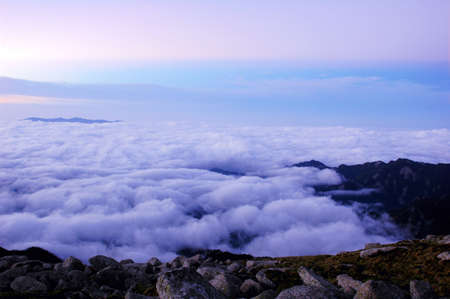 Cloudscape on the top of the mountains at sunriseの写真素材
