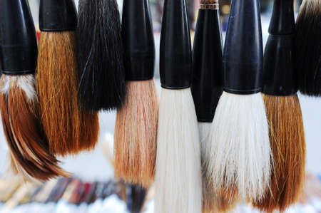 Closeup view of a bundle of Chinese brush pens for calligraphyの写真素材