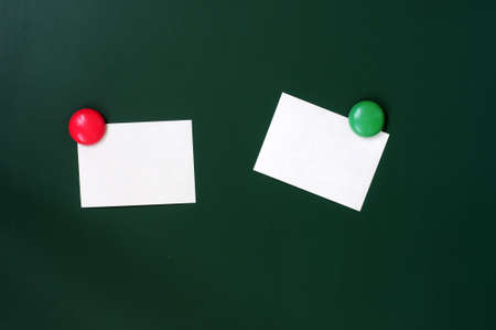 Blank stick note on a green board with copy space