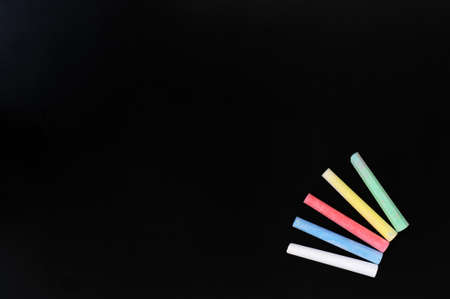 Blank blackboard background with colorful chalk for text writing and designの写真素材