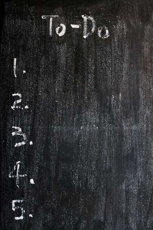 Blank to-do list drawn with white chalk on a smudged blackboard