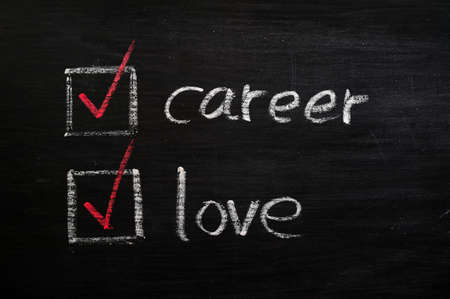 Love and career choices with check boxes drawn with chalk on a blackboardの写真素材