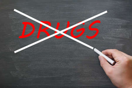 Say no to drugs - crossing out drugs on a smudged blackboard with chalkの写真素材