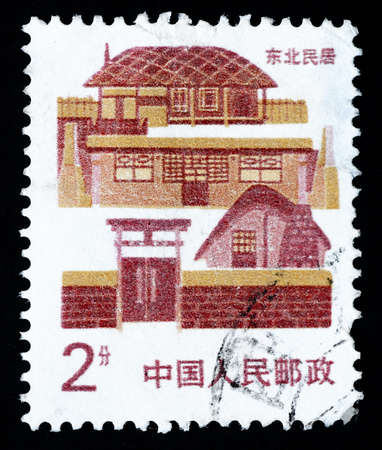 A Stamp printed in China shows local dwelling in Northeast Chinaのeditorial素材