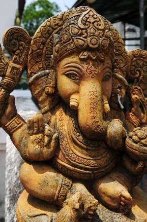 Ancient  sculpture of Indian god Lord Ganesh, god of luck and prosperity in Thailandの写真素材