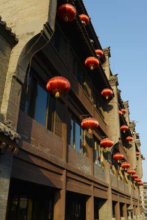 Chinese ancient buildings with red lamps at the city center of Xian, Chinaの写真素材