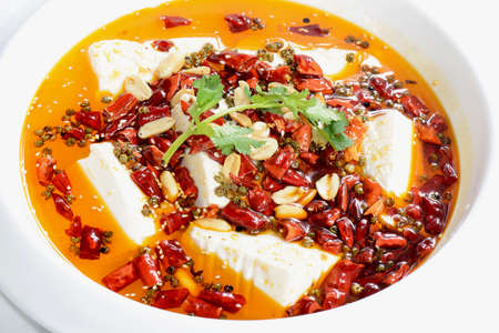 Chinese Food: Boiled Tofu with red pepper in a white plateの写真素材
