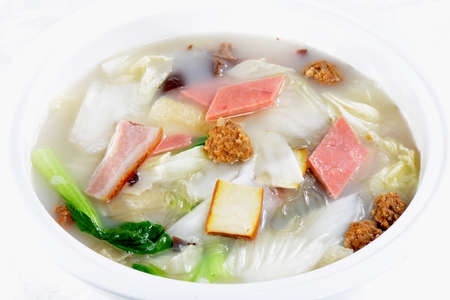 Chinese Food: Vegetable soup in a white potの写真素材