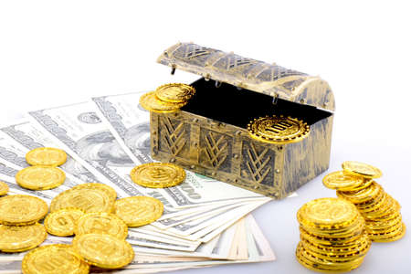 Copper box with gold coins and dollar banknotesの写真素材