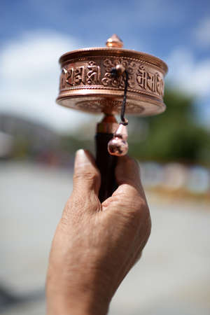 Prayer Wheel against blue sky in Tibetの写真素材