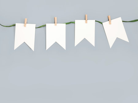 White paper garland cut against a bright beige wall backgroundの写真素材