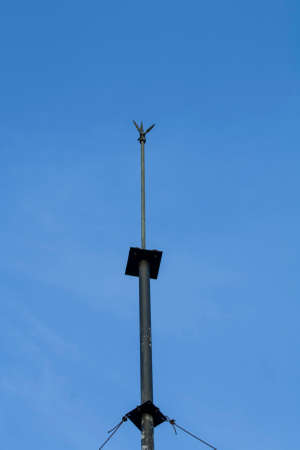 a metal rod or wire fixed to an exposed part of a building or other tall structure to divert...