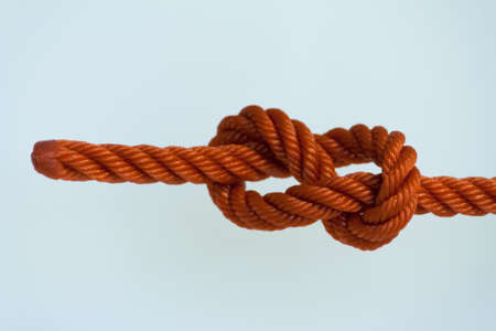 Figure-eight knotted on a white background.の写真素材