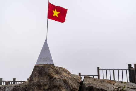 Peak of Fansipan and flag in the clouds on SAPA VIETNAM. Top spot in Indochina altitude 3,143m landmark in VIETNAMのeditorial素材