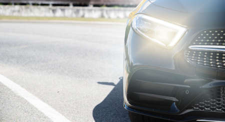 focus of Luxury car headlights and Front bumper on racetrack.の写真素材