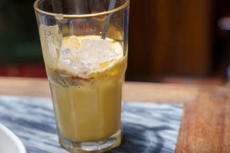 Vietnamese egg coffee in the white coffee mug in HANOI VIETNAM