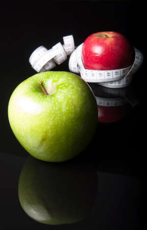 apples surrounded by measurement on black