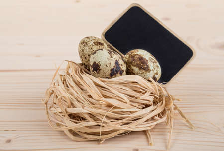 quail eggs with blackboardの写真素材
