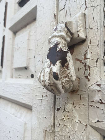 close up of a wooden door knob shaped handの写真素材
