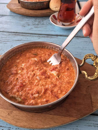 traditional breakfast with omelet and turkish tea on wooden tableの写真素材
