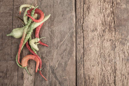 Some fresh peppers on wooden table with copy space