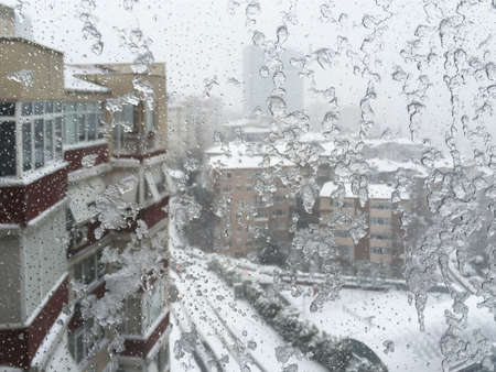 Snow winter blizzard on city streetsの写真素材