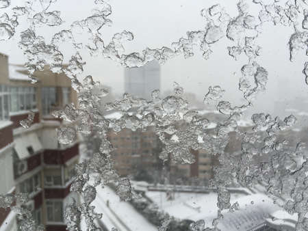 Snow winter blizzard on city streetsの写真素材