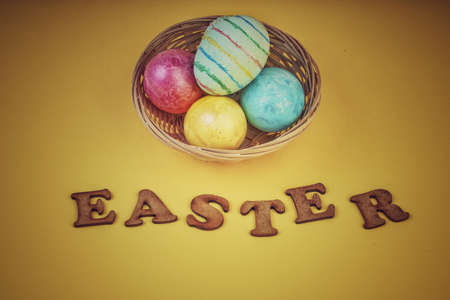 Easter template with colorful eggs in a basket