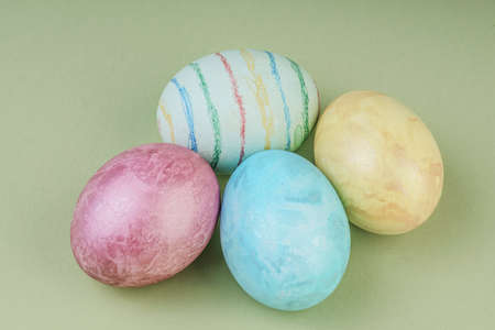 Colorful easter eggs on green background