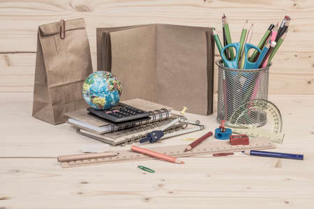 back to school template with multiple stationary on wooden tableの写真素材