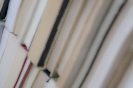 blurred background with stacks of bookの写真素材