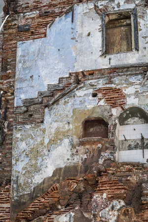 Neglected old and abandoned buildings wall as a backgroundの写真素材