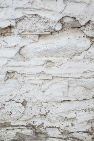 An old and cracked wall as a backgroundの写真素材