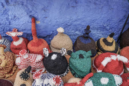 Colorful knitted hats as a background