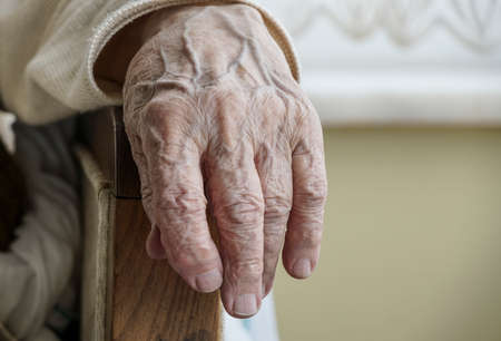 Closeup wrinkled hand of a senior personの写真素材