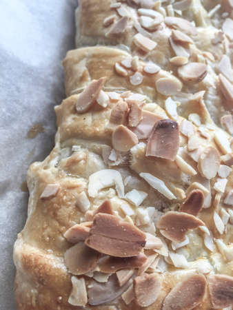 closeup of a puff pastry decorated with peanutsの写真素材