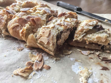closeup of a puff pastry decorated with peanuts