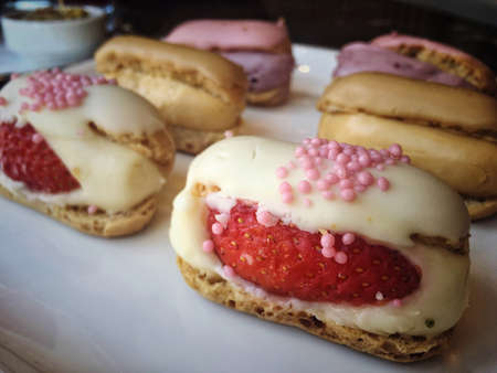 Small eclair cakes on plate