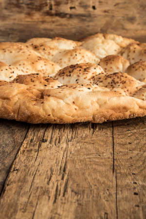 pitta bread on a wooden table with copy space