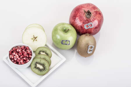 real and fresh mixed fruit juice (like can drink) and fruit plate on whiteの写真素材