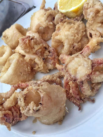 Delicious and crispy fried calamari on tableの写真素材