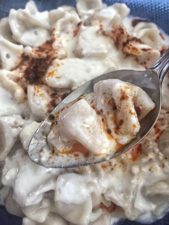 Closeup of turkish ravioli on a blue plateの写真素材