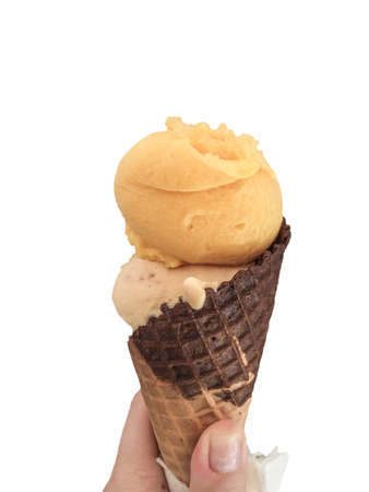 A female hand holding an ice cream isolated on white