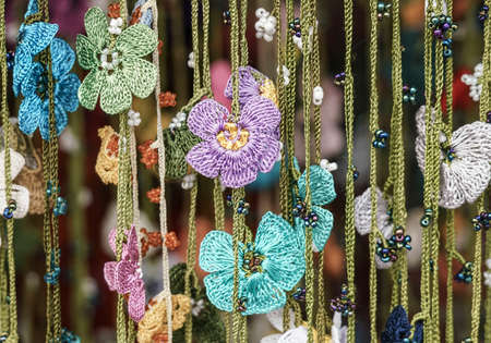 colorful needlework flowers as a backgroundの写真素材