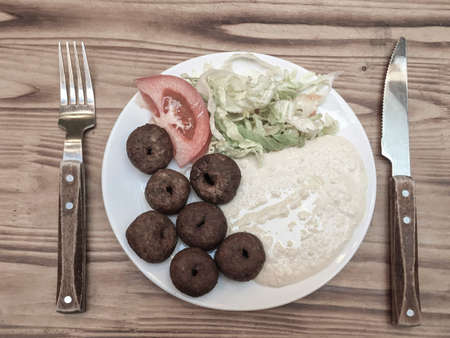 meatball and appetizer on a wooden table